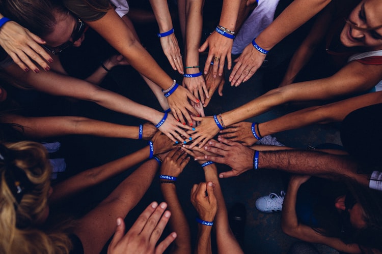 Team high five circle